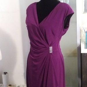 Purple pleated jeweled dress.